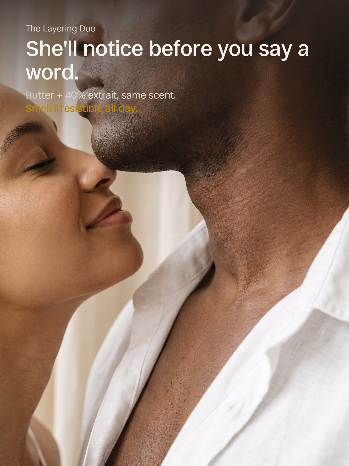 A woman leans in close to a man's neck to smell his scent